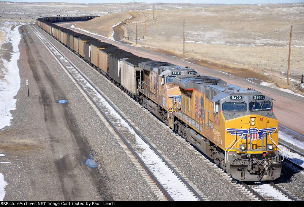 Loaded coal train climbs upgrade